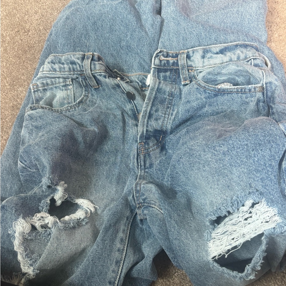 Fashion Nova Light Blue Ripped Womans Jeans